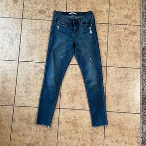 Mid Rise Distressed Skinny Jeans